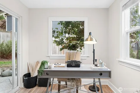 a view of a dining room with furniture window and outside view