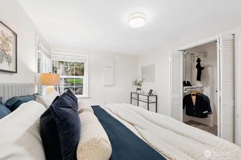 a living room with furniture and a lamp