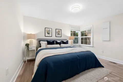 a bed room with a bed and a window