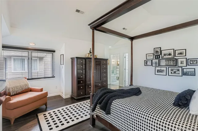 a bedroom with furniture and a window