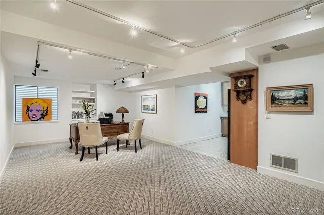a view of a livingroom with furniture and a dinning area
