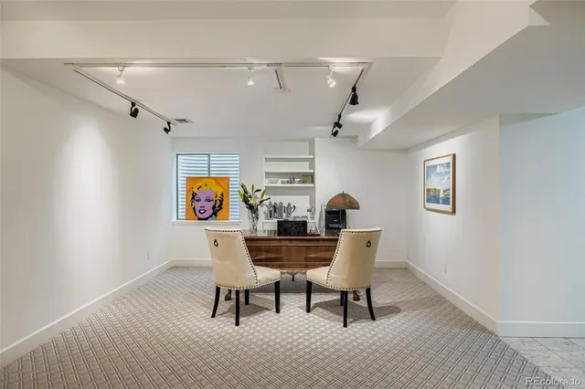 a view of a workspace with furniture