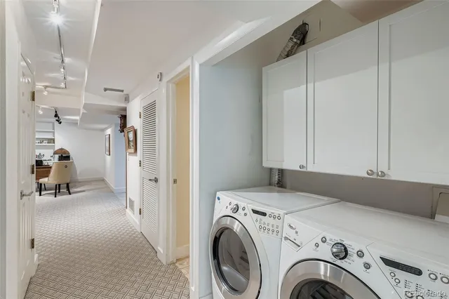 a view of hallway with washer and dryer