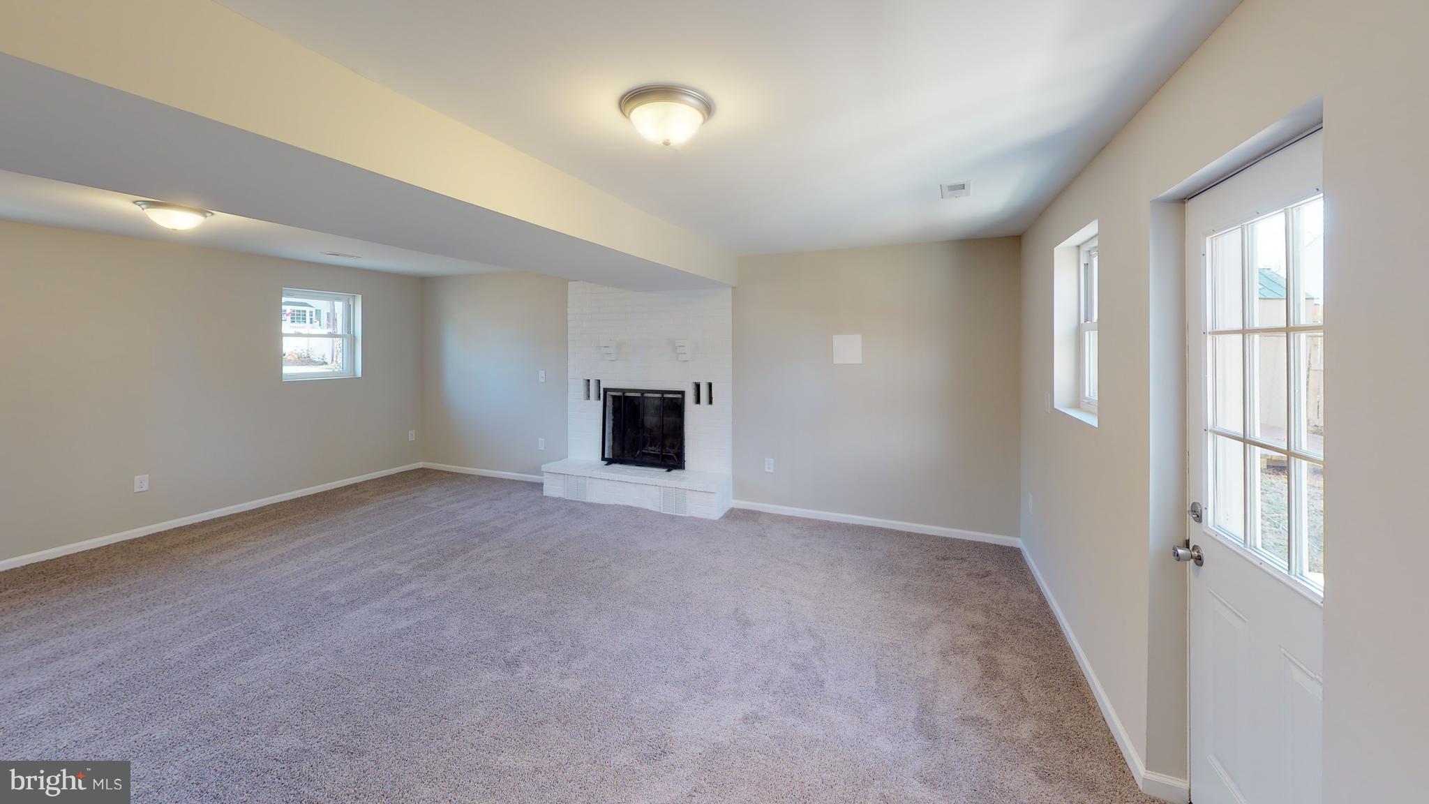 1812 Laurel Road Edgewater, MD 21037 - Photo 13 of 17 Basement Rec Room w/Wood Burning Fireplace