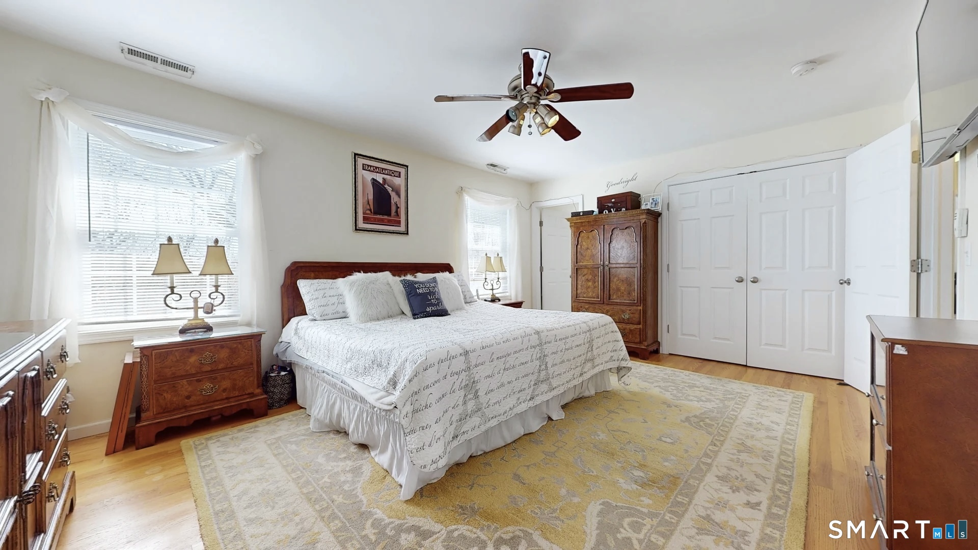 25 Stephen Street Derby, CT 06418 - Photo 14 of 29 a spacious bedroom with a bed and a chandelier