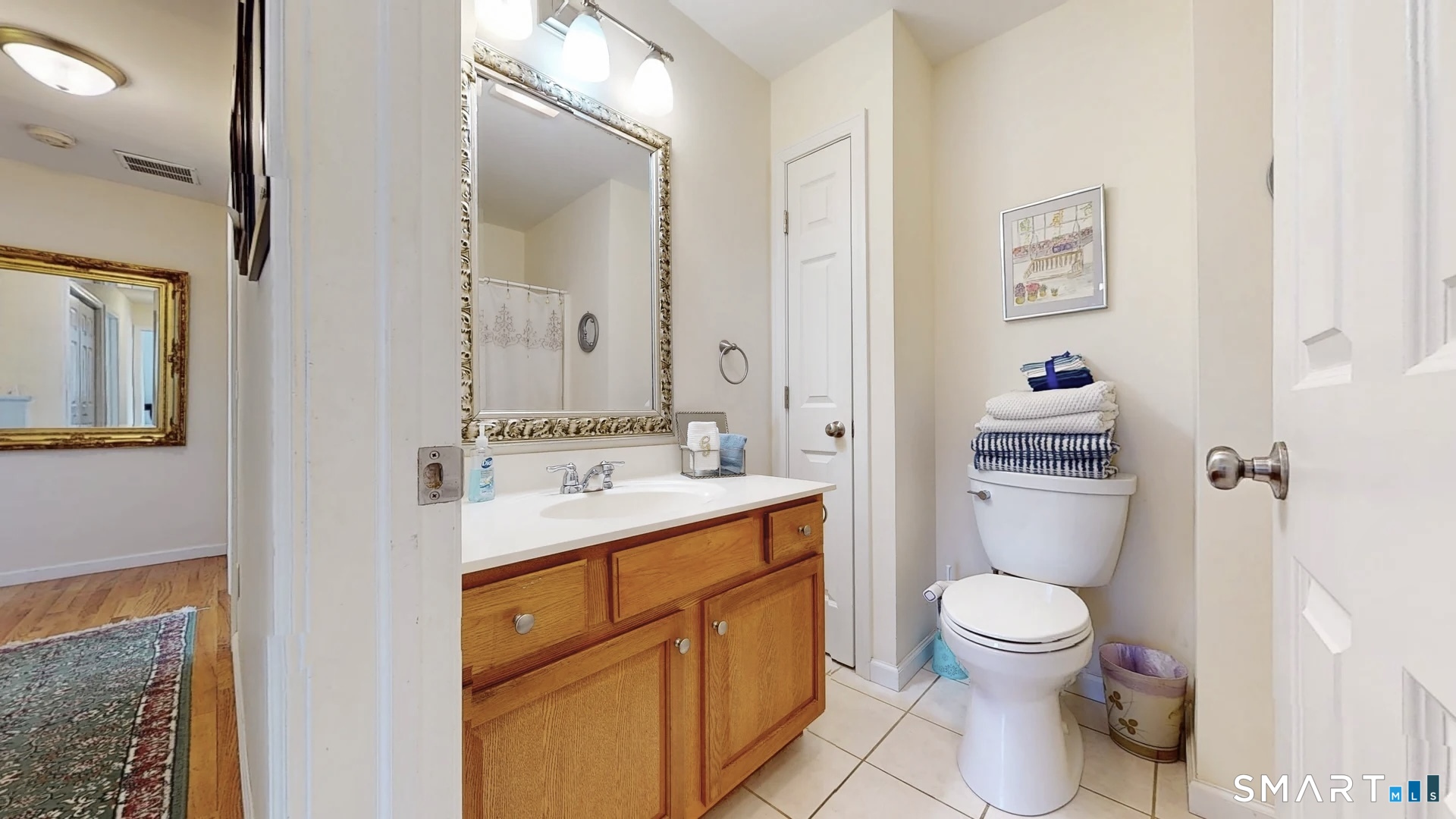 25 Stephen Street Derby, CT 06418 - Photo 17 of 29 a bathroom with a toilet sink vanity and mirror