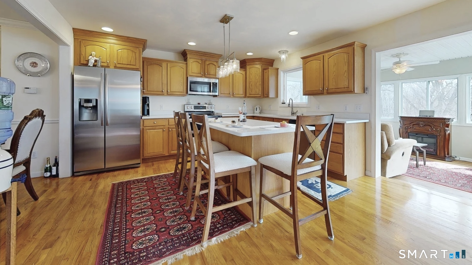 25 Stephen Street Derby, CT 06418 - Photo 2 of 29 a kitchen with stainless steel appliances granite countertop a table chairs refrigerator and microwave