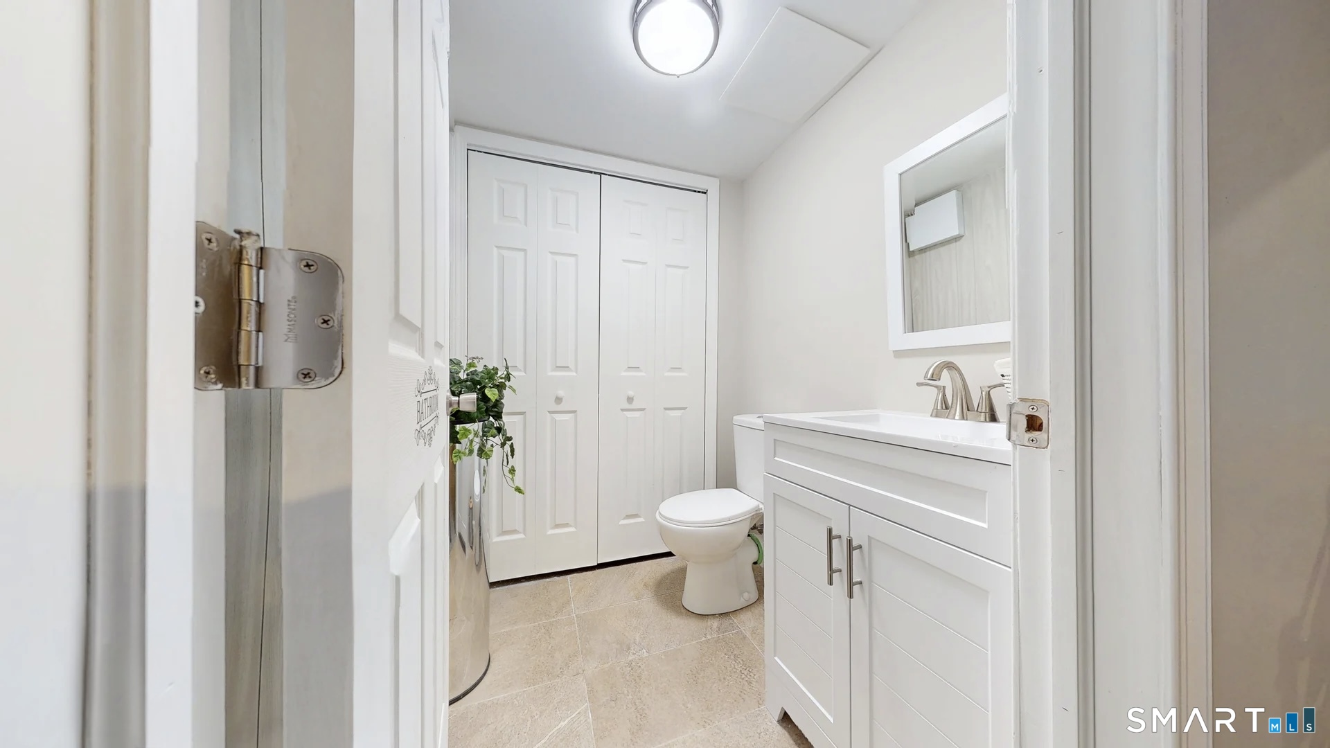 25 Stephen Street Derby, CT 06418 - Photo 25 of 29 a bathroom with a toilet sink vanity and shower