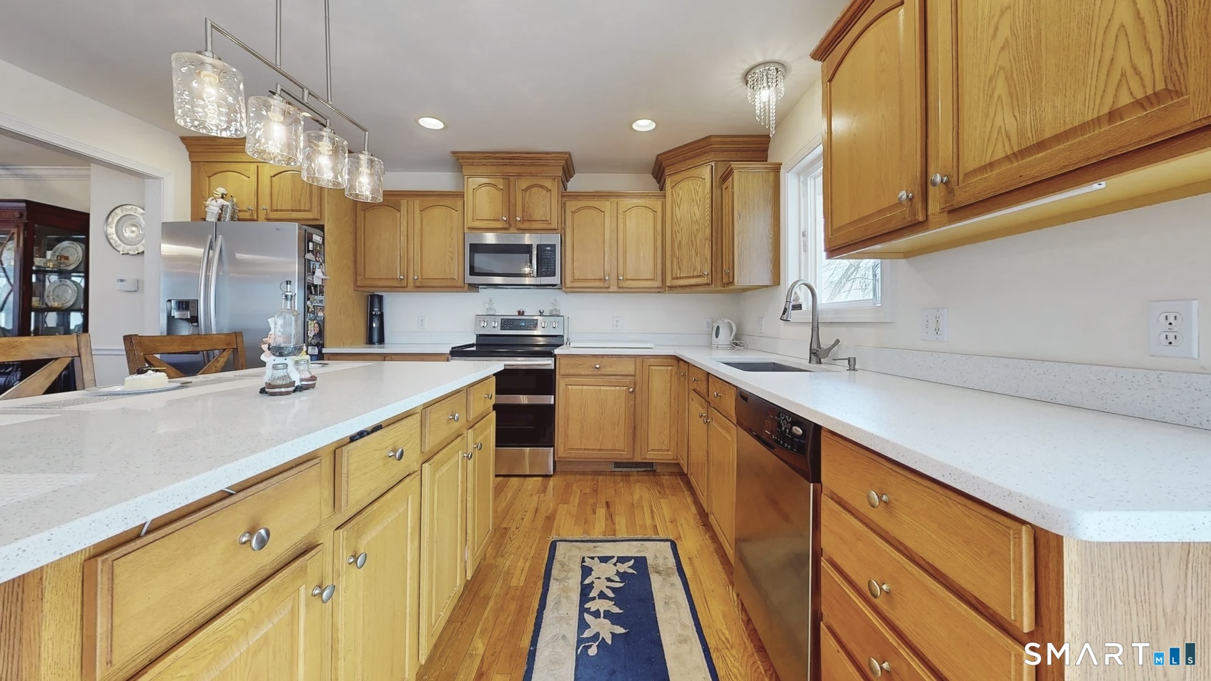 25 Stephen Street Derby, CT 06418 - Photo 3 of 29 a kitchen with stainless steel appliances granite countertop a sink a stove and cabinets