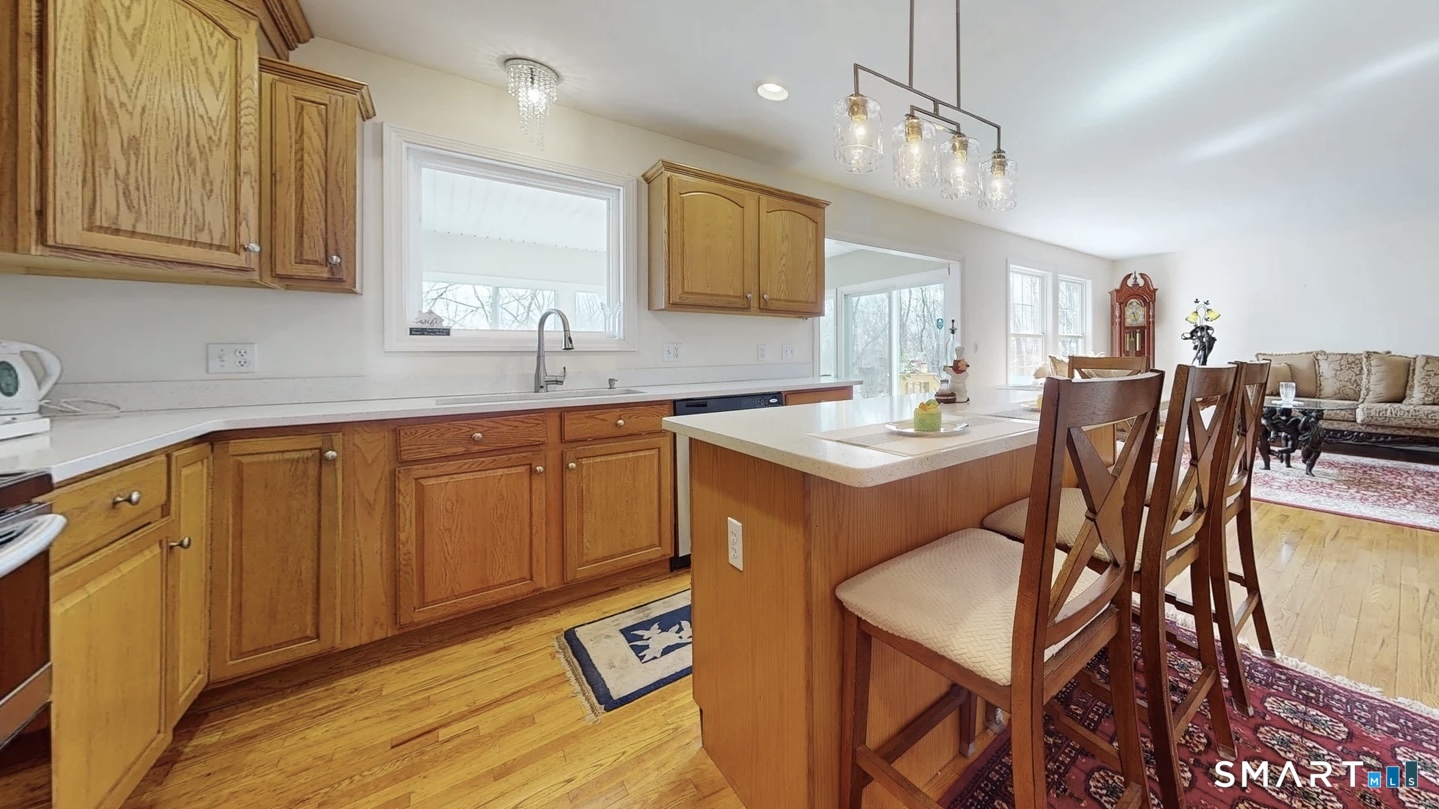 25 Stephen Street Derby, CT 06418 - Photo 4 of 29 a kitchen with a sink cabinets and wooden floor