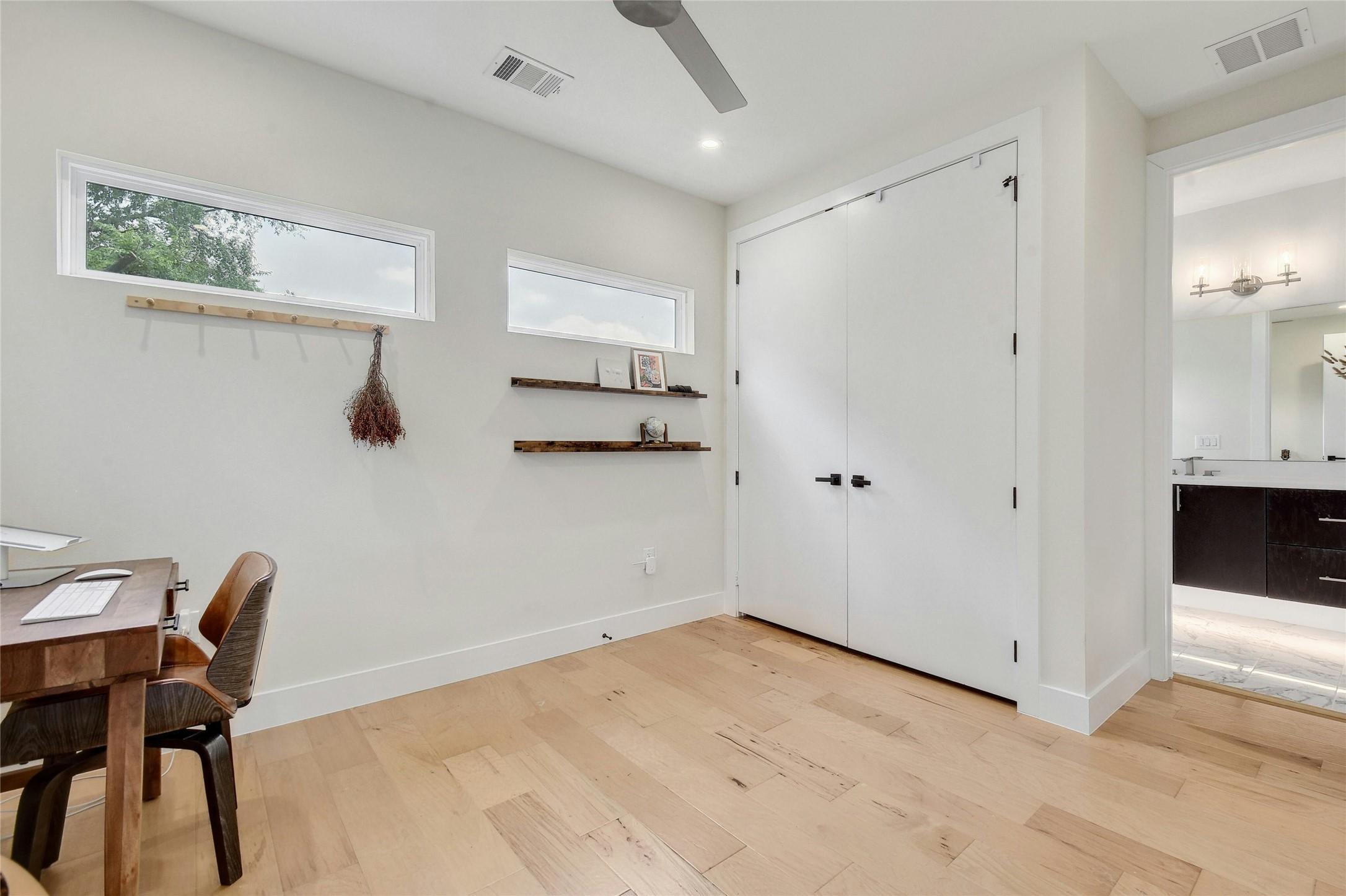 4606 Ledesma Road, Unit 2 Austin, TX 78721 - Photo 22 of 33 Bright hardwood floors and clean white walls frame a versatile space.