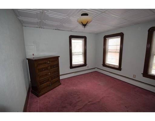 182 Cottage Street Athol, MA 01331 - Photo 13 of 28 a view of an empty room with a window and fireplace