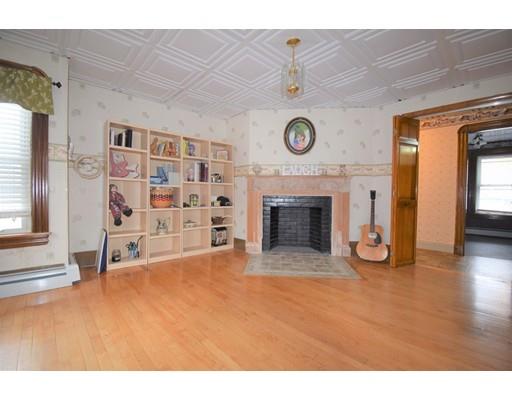 182 Cottage Street Athol, MA 01331 - Photo 19 of 28 a view of an empty room with a fireplace and a window