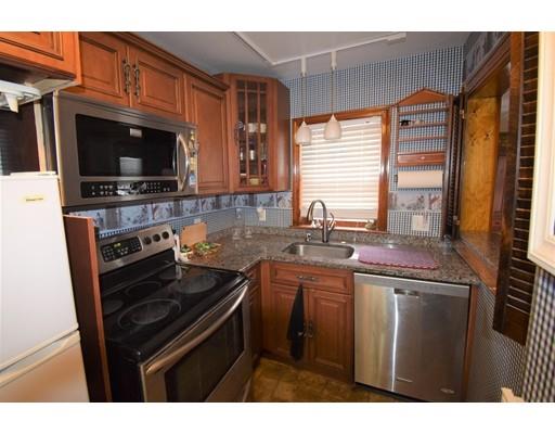 182 Cottage Street Athol, MA 01331 - Photo 21 of 28 a kitchen with stainless steel appliances a stove sink and microwave