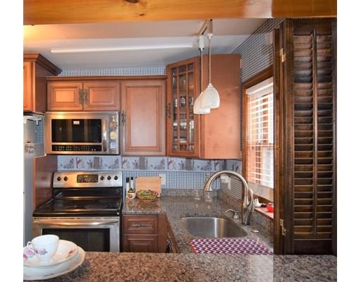 182 Cottage Street Athol, MA 01331 - Photo 22 of 28 a kitchen with a stove a sink and a microwave