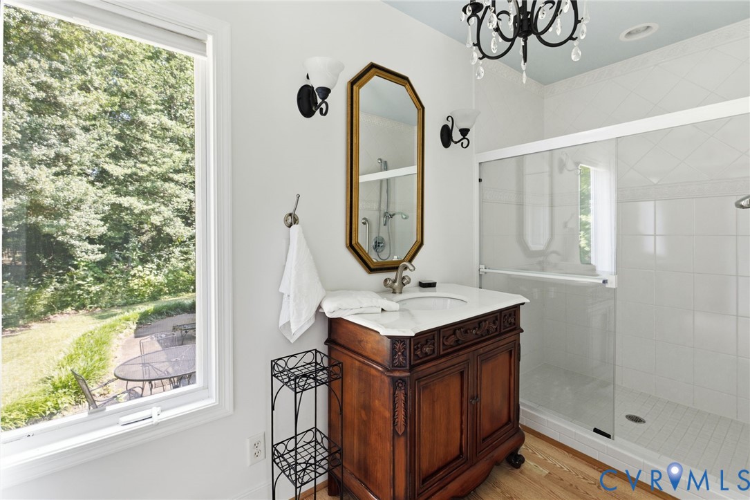 8208 Michael Road Henrico, VA 23229 - Photo 20 of 29 Bathroom featuring a carved wood vanity with a whi