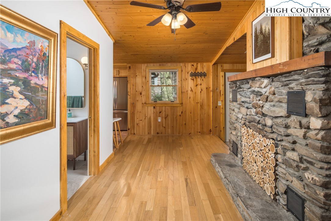 280 Chinkapin Ridge Road Seven Devils, NC 28604 - Photo 11 of 36 a view of a hallway with wooden floor and staircase