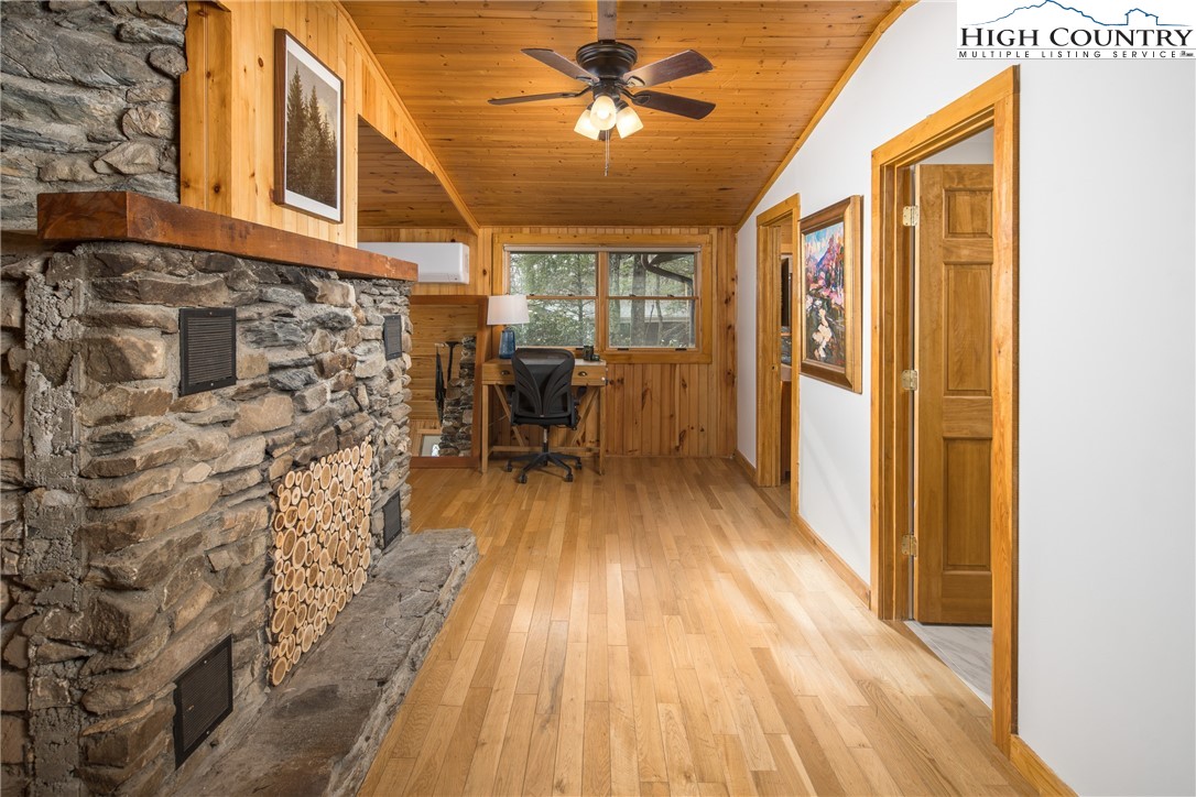 280 Chinkapin Ridge Road Seven Devils, NC 28604 - Photo 12 of 36 a very nice looking room with wooden floor and furniture