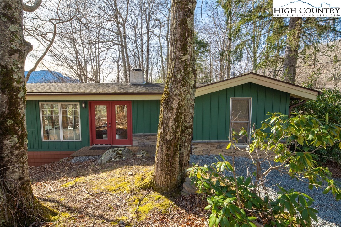 280 Chinkapin Ridge Road Seven Devils, NC 28604 - Photo 2 of 36 a front view of a house with garden