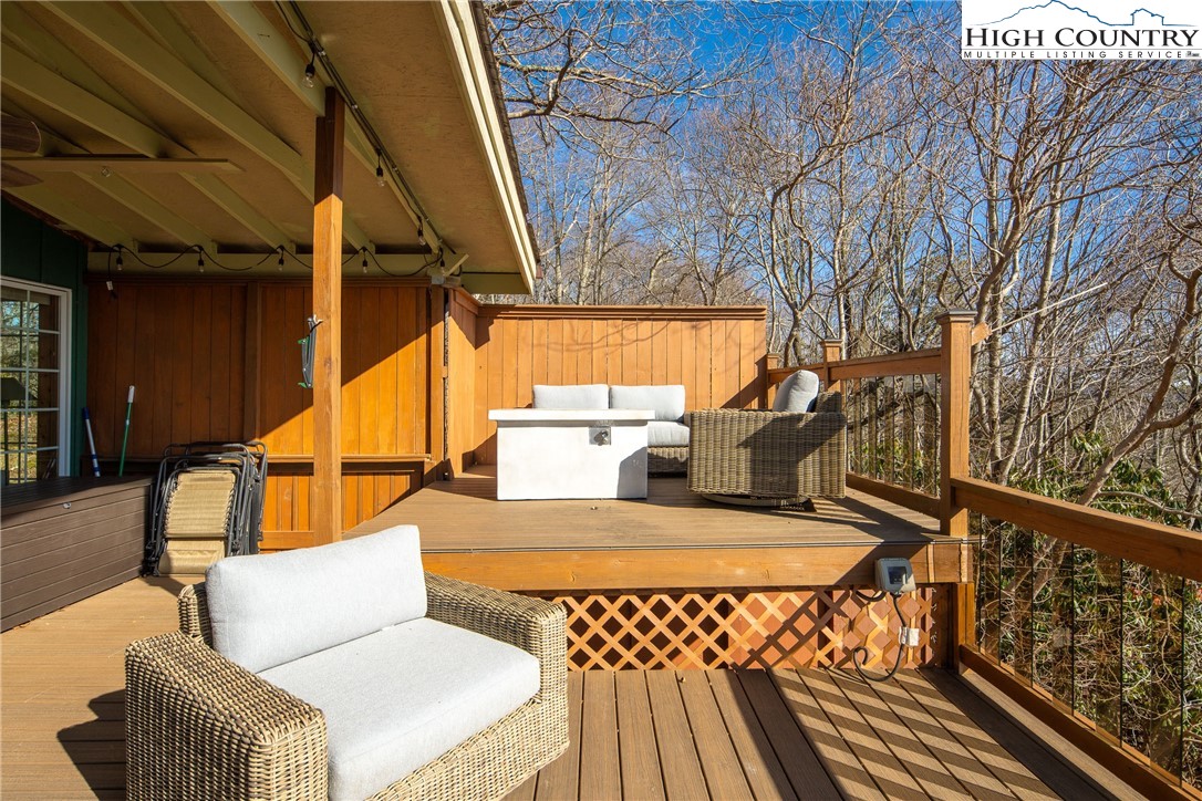 280 Chinkapin Ridge Road Seven Devils, NC 28604 - Photo 28 of 36 a view of balcony with furniture and wooden deck