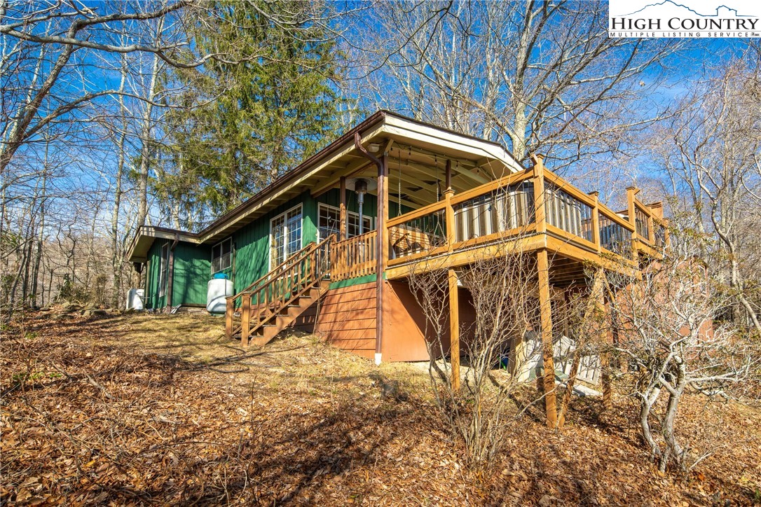 280 Chinkapin Ridge Road Seven Devils, NC 28604 - Photo 33 of 36 a view of a house with a yard