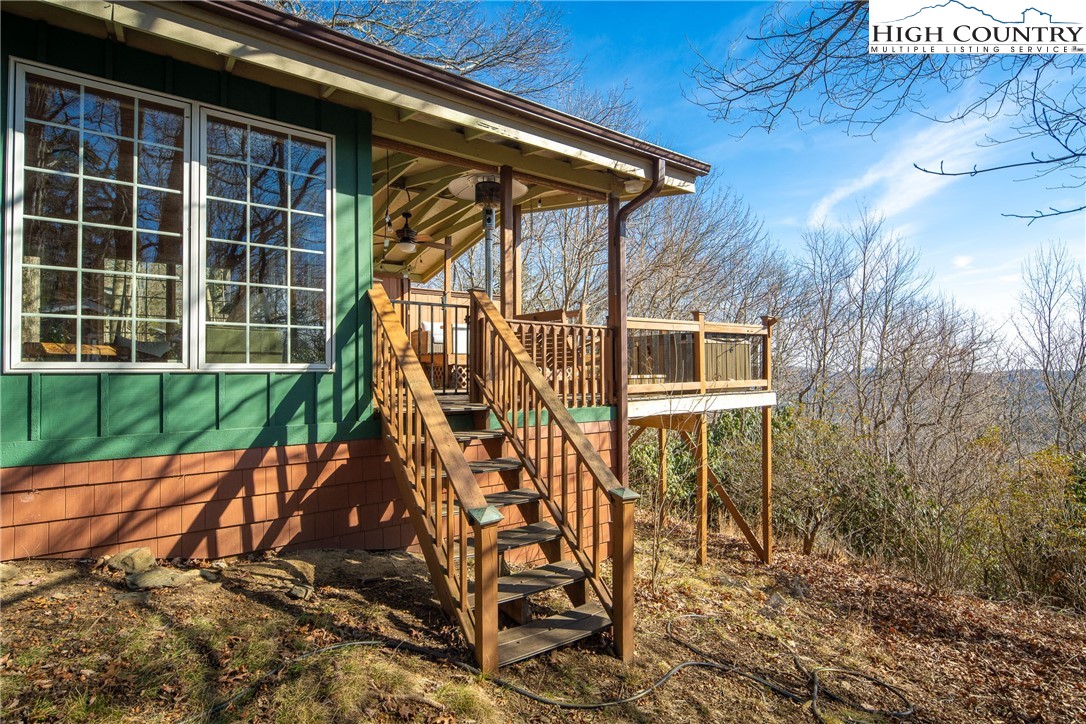 280 Chinkapin Ridge Road Seven Devils, NC 28604 - Photo 34 of 36 a view of a house with a yard