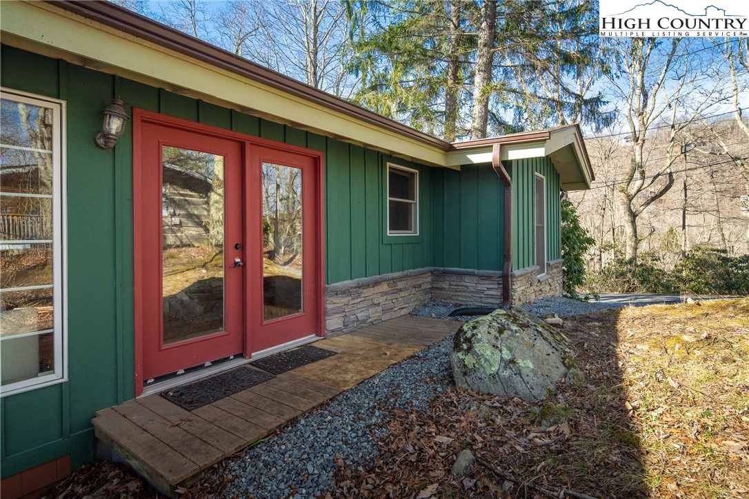 280 Chinkapin Ridge Road Seven Devils, NC 28604 - Photo 4 of 36 a view of a house with a yard