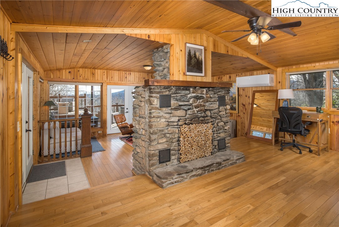 280 Chinkapin Ridge Road Seven Devils, NC 28604 - Photo 9 of 36 a view of a patio with table and chairs and potted plants