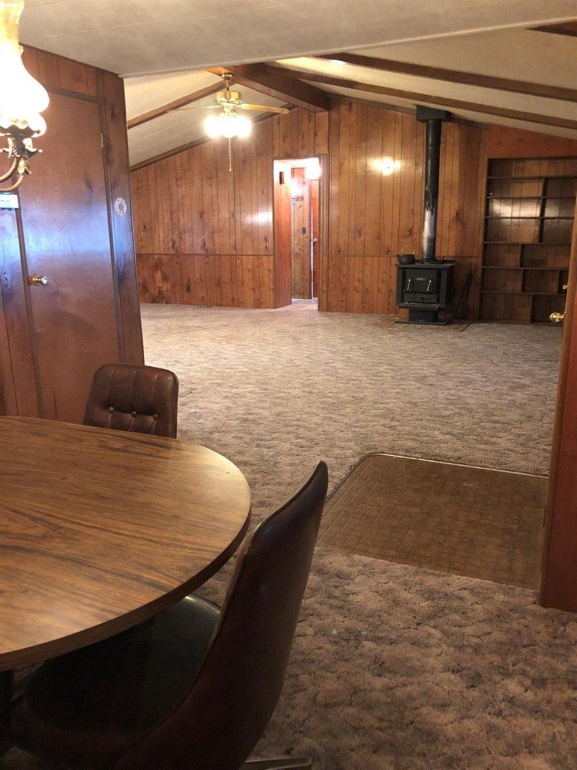 6226 East Evans Creek Road, Unit 15 Rogue River, OR 97537 - Photo 14 of 30 a large room with wooden floor