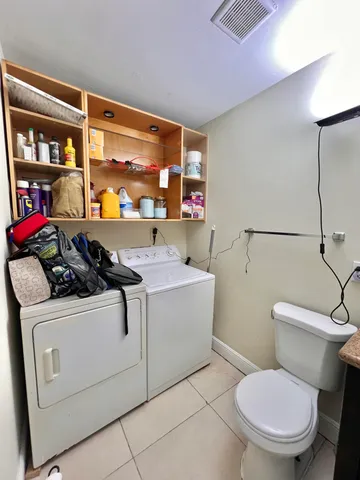 a bathroom with a sink a toilet and a shower