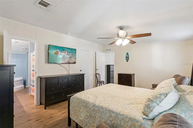 a en suite bathroom with a sink double vanity and a mirror