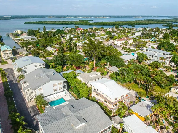 an aerial view of a house with a lake view