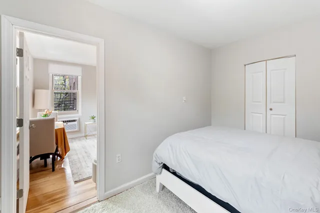 a bedroom with a bed and a table in it