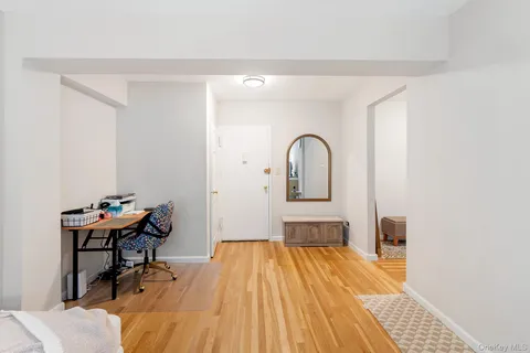 a living room with a bed and furniture