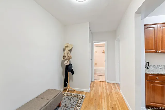 view of room with window and hallway