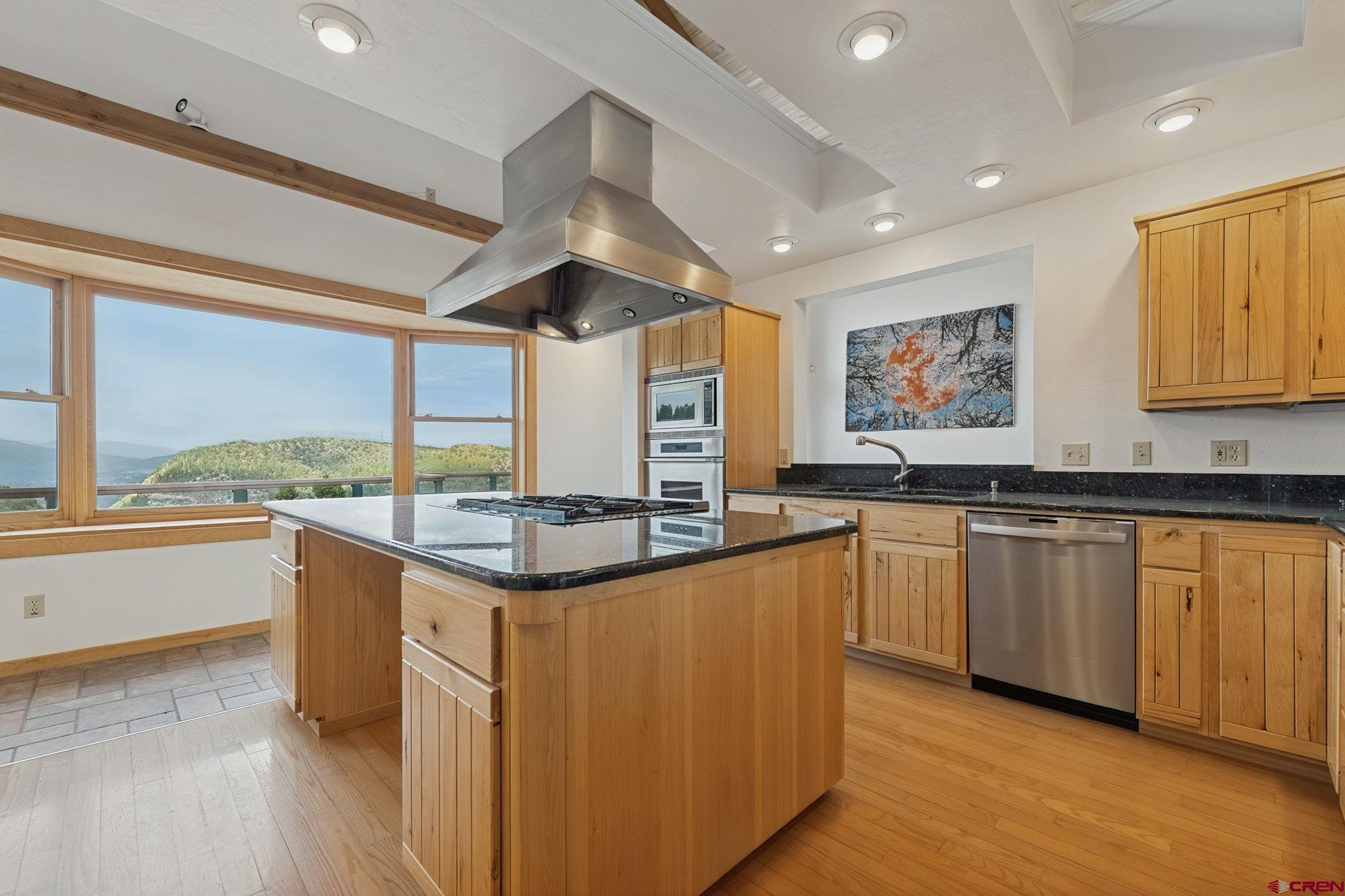 481 Far View Road Durango, CO 81303 - Photo 11 of 44 a kitchen with stainless steel appliances granite countertop a stove and a refrigerator