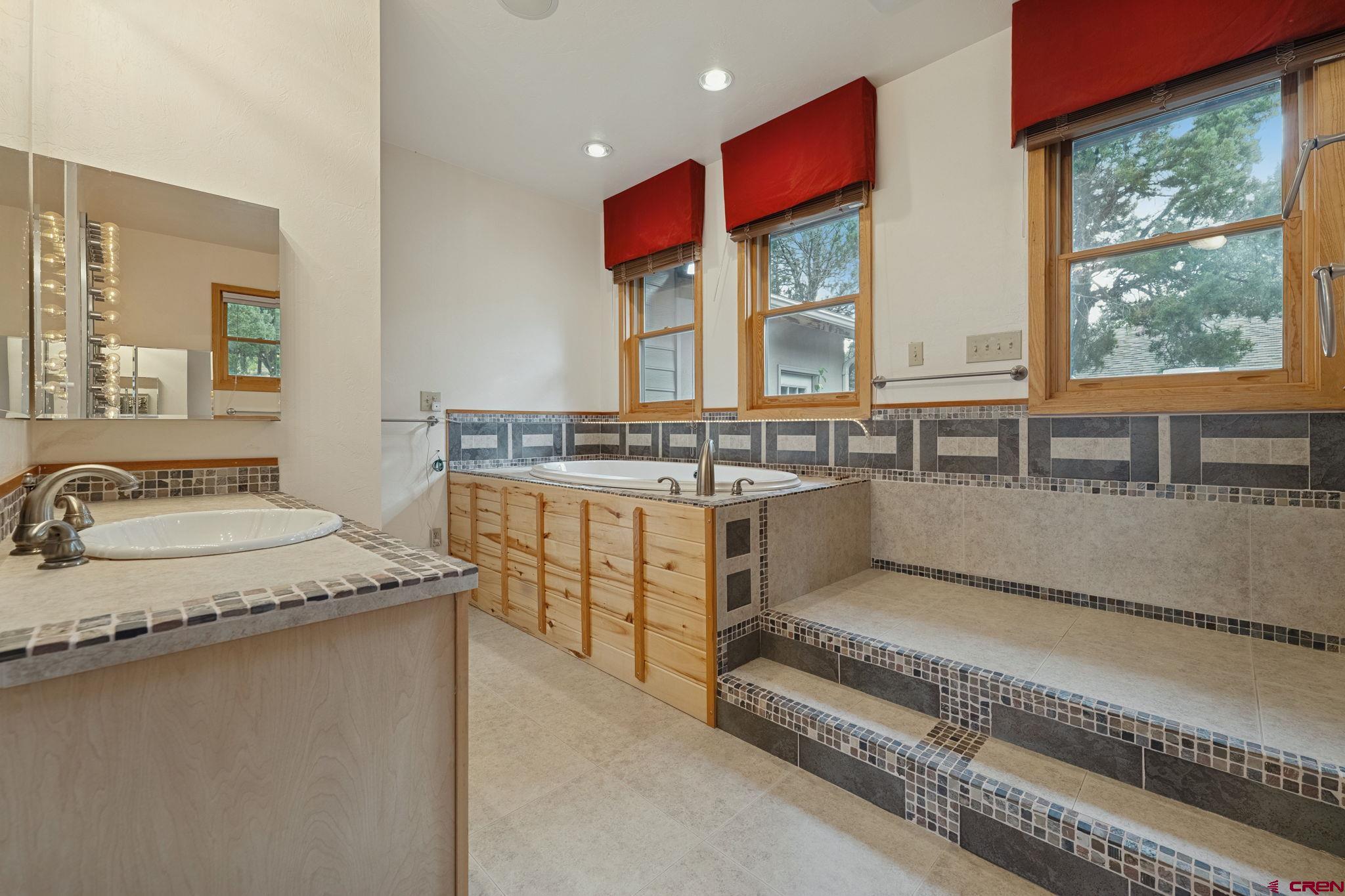481 Far View Road Durango, CO 81303 - Photo 18 of 44 a kitchen with stainless steel appliances granite countertop a stove a sink and a microwave
