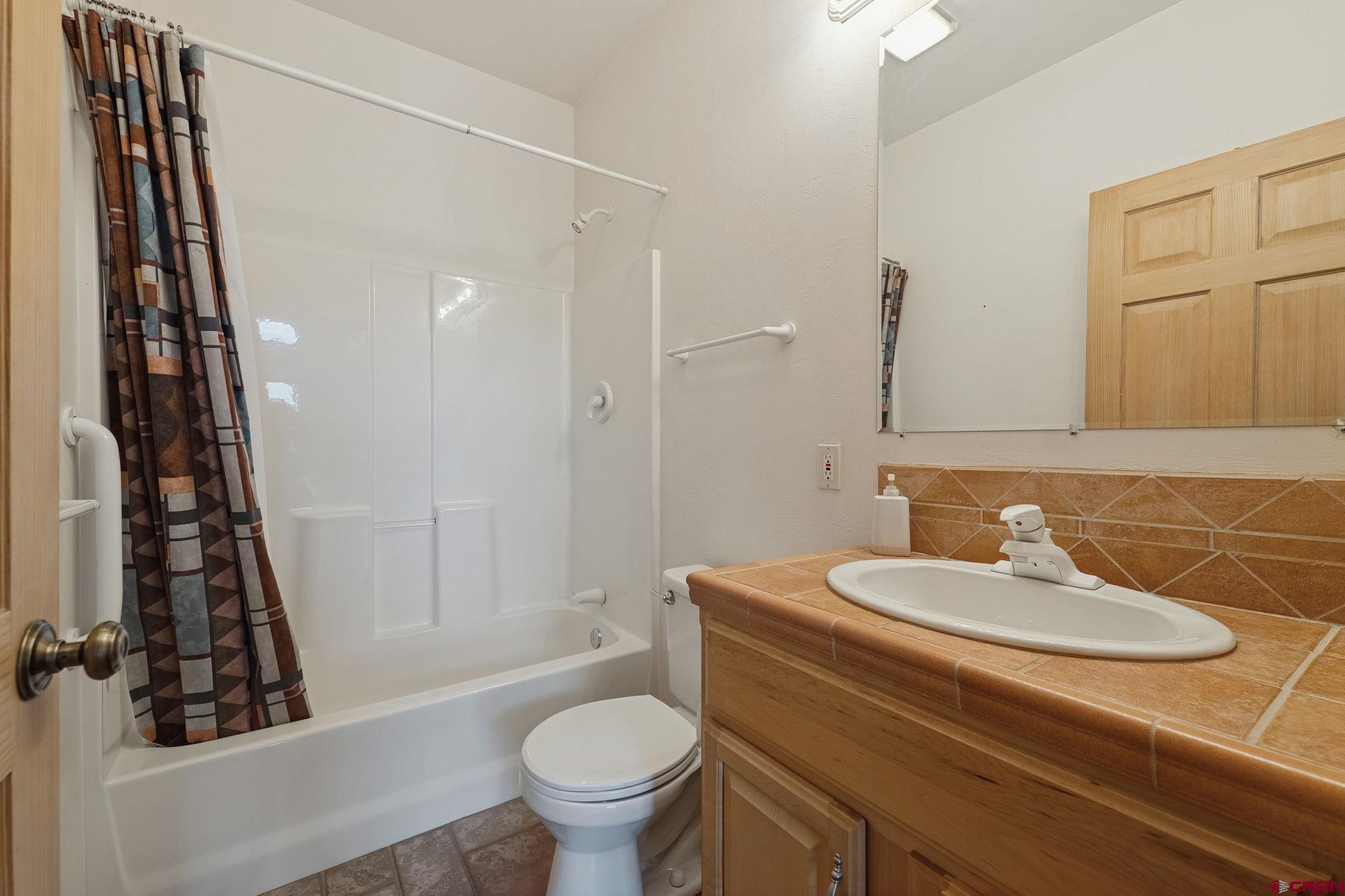 481 Far View Road Durango, CO 81303 - Photo 22 of 44 a bathroom with a sink toilet and shower