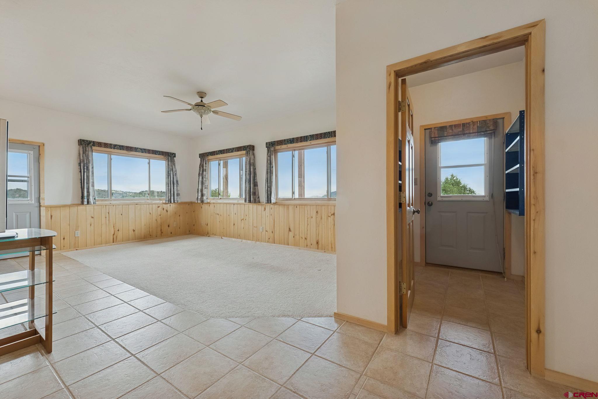 481 Far View Road Durango, CO 81303 - Photo 27 of 44 a spacious bedroom with a bed and a table