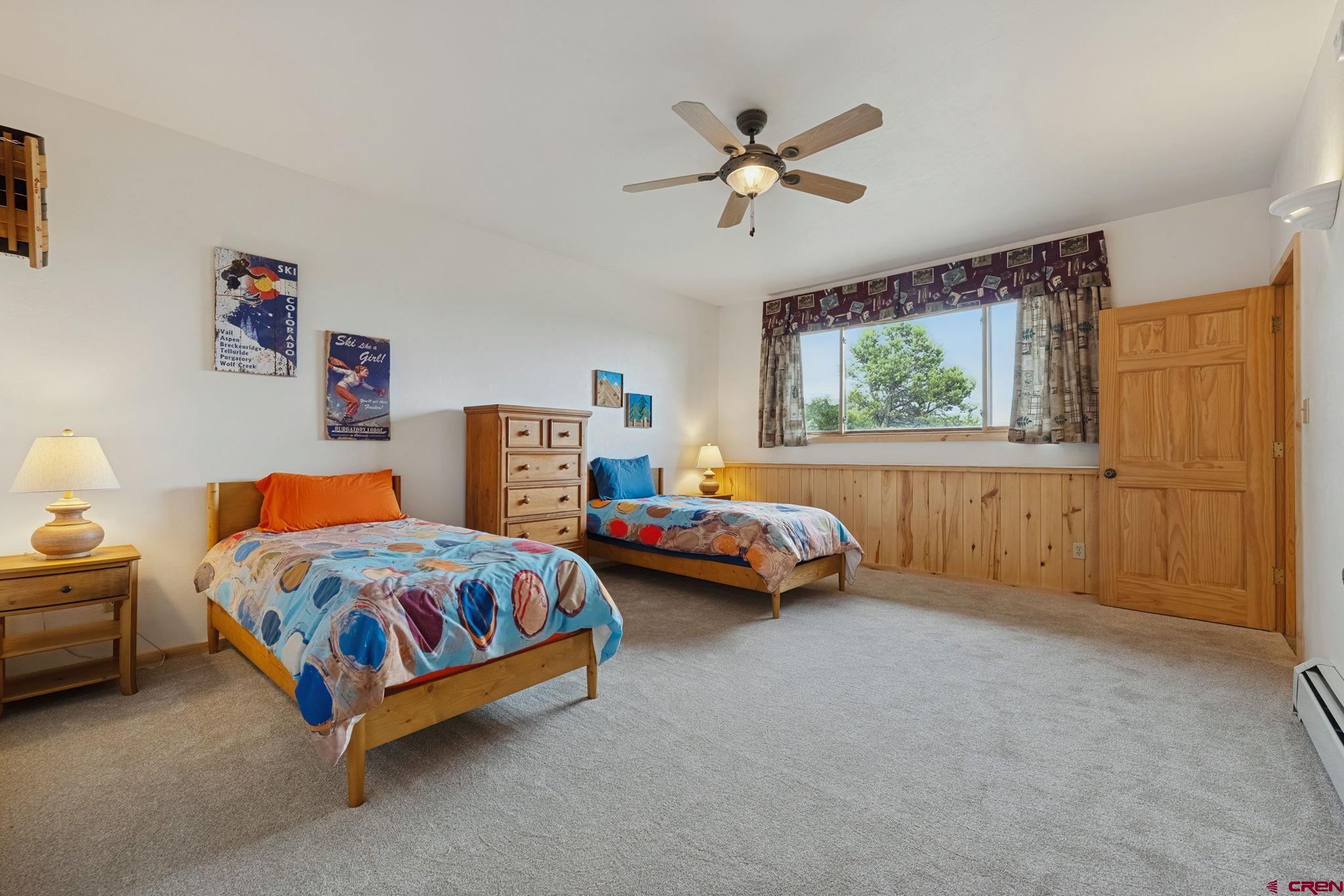 481 Far View Road Durango, CO 81303 - Photo 32 of 44 a bedroom with two beds and window