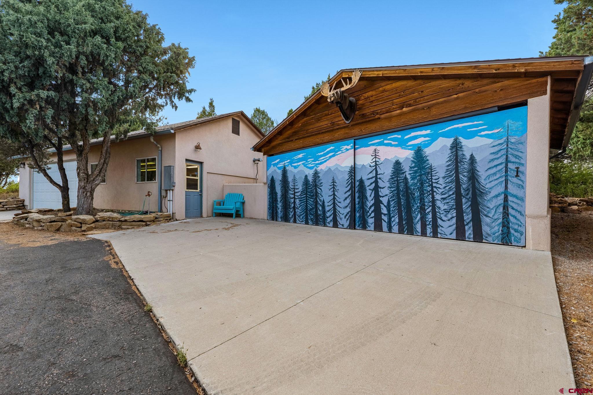 481 Far View Road Durango, CO 81303 - Photo 43 of 44 a view of wooden house with a small yard