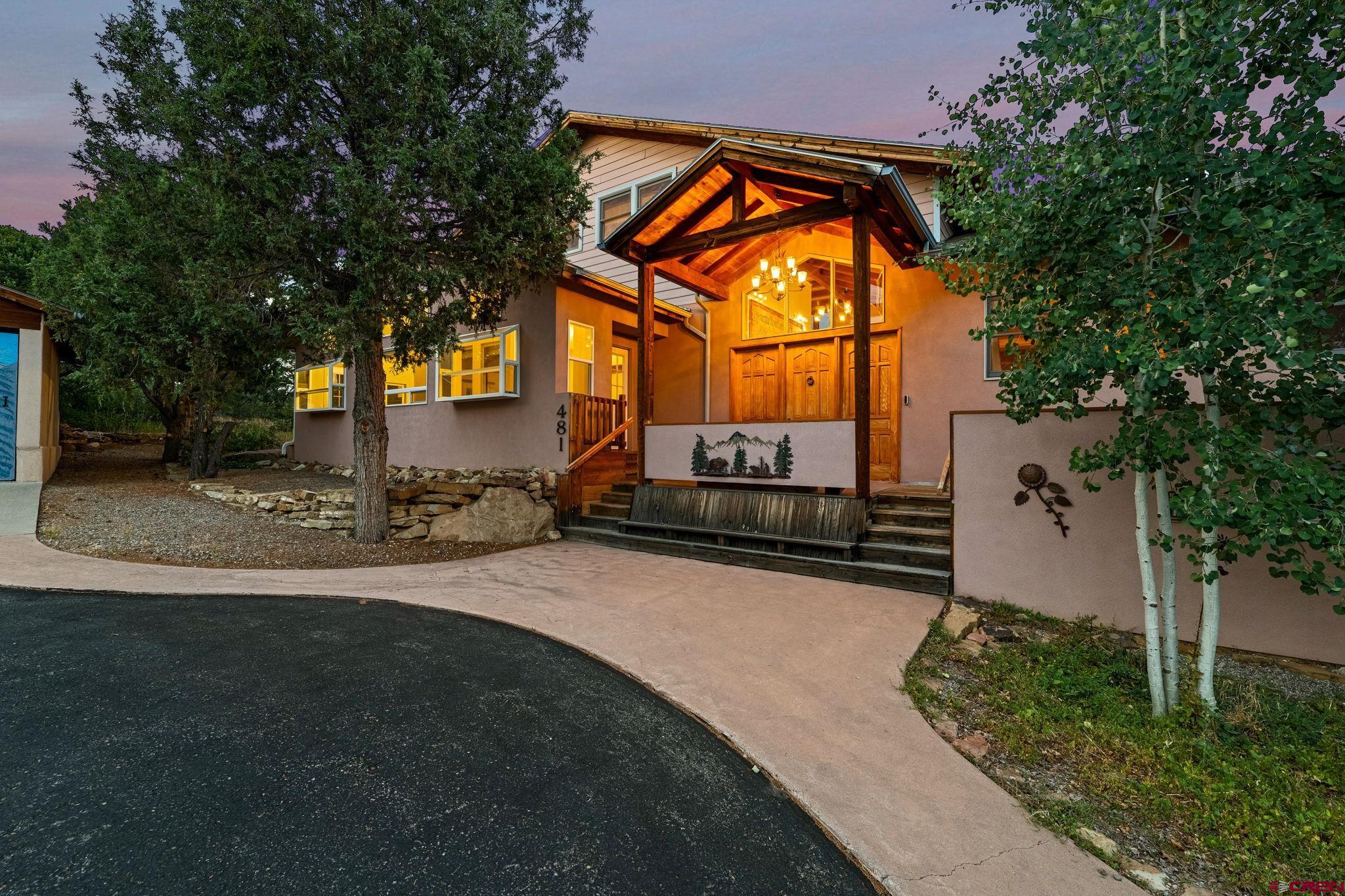 481 Far View Road Durango, CO 81303 - Photo 5 of 44 a backyard of a house with dishwasher and wooden fence