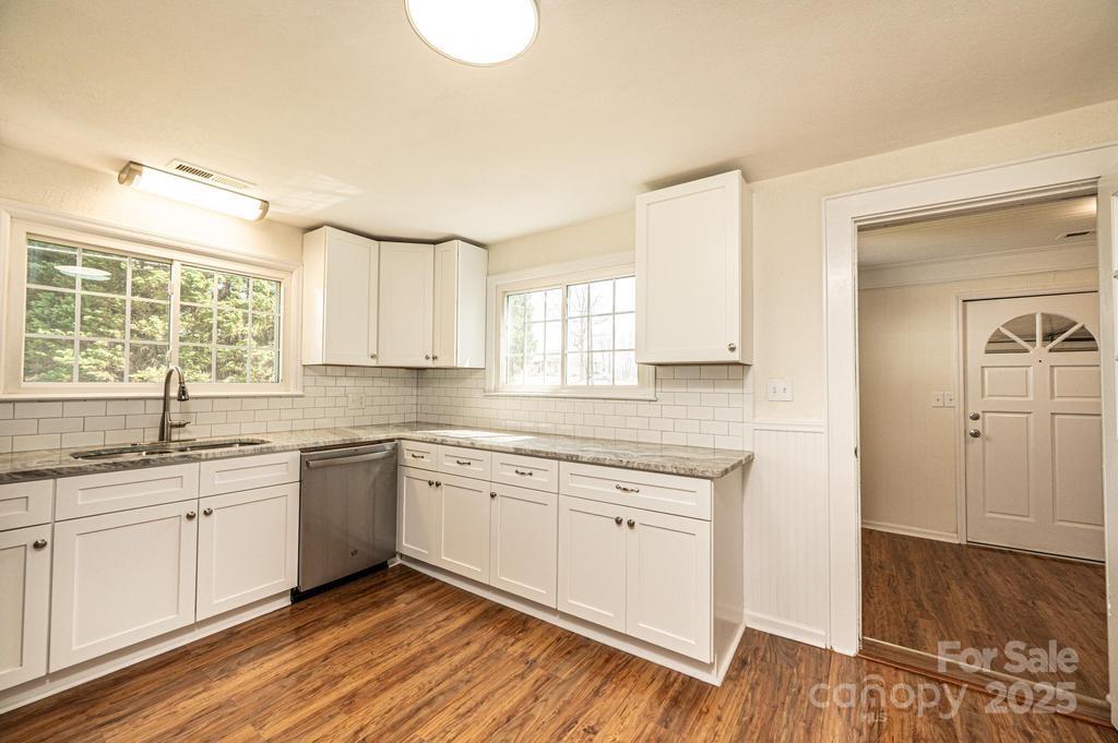1993 Moss Farm Road Hickory, NC 28602 - Photo 12 of 36 a kitchen with a sink cabinets and window