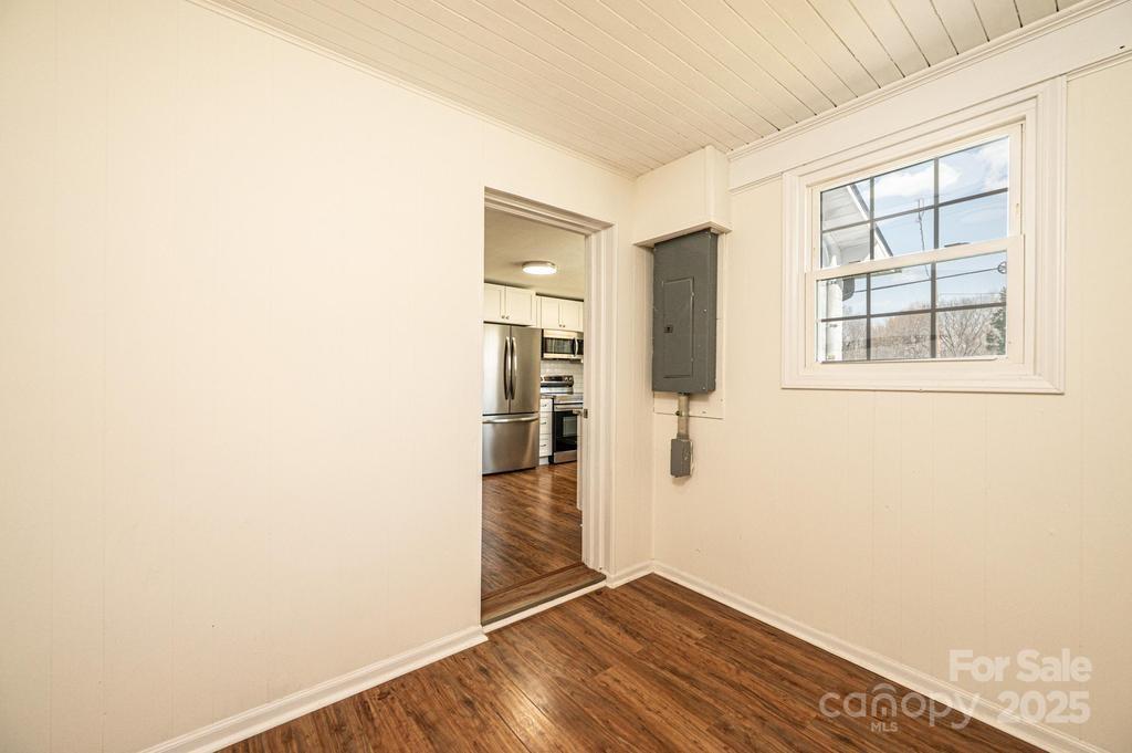 1993 Moss Farm Road Hickory, NC 28602 - Photo 14 of 36 a view of an empty room with wooden floor and a window