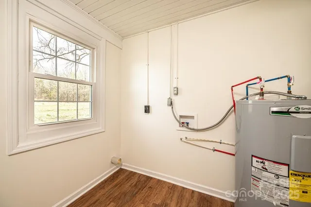a view of a storage & utility room with a window