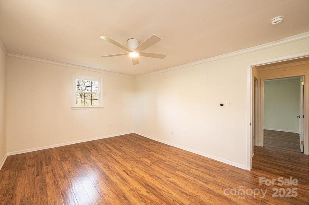 1993 Moss Farm Road Hickory, NC 28602 - Photo 21 of 36 an empty room with wooden floor and windows