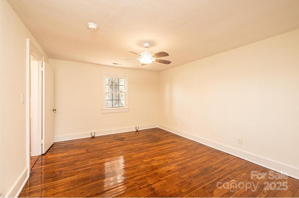 1993 Moss Farm Road Hickory, NC 28602 - Photo 30 of 36 a view of empty room with wooden floor and fan