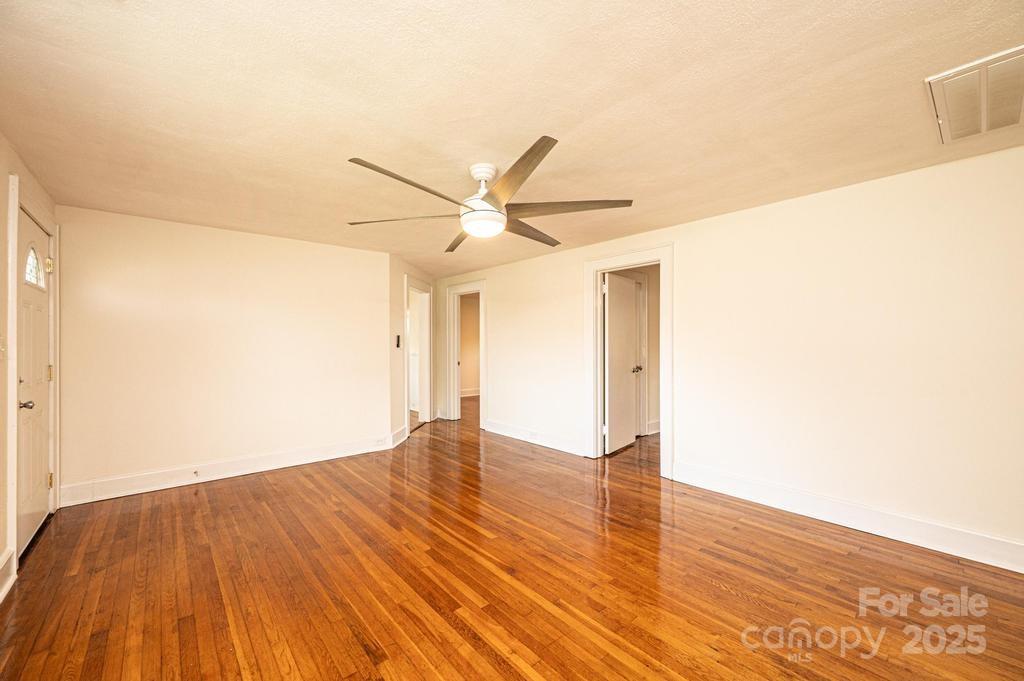 1993 Moss Farm Road Hickory, NC 28602 - Photo 6 of 36 a view of empty room with wooden floor