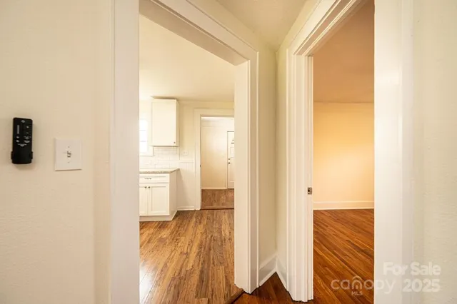 a view of a bathroom from a hallway