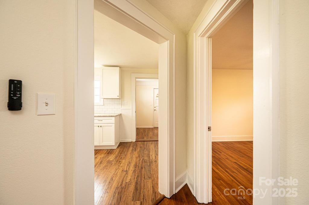 1993 Moss Farm Road Hickory, NC 28602 - Photo 7 of 36 a view of a bathroom from a hallway